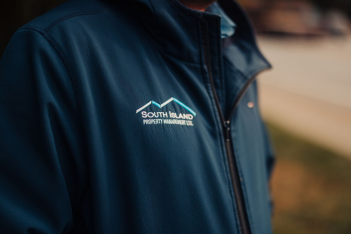 Close up of outerwear for South Island Property Management