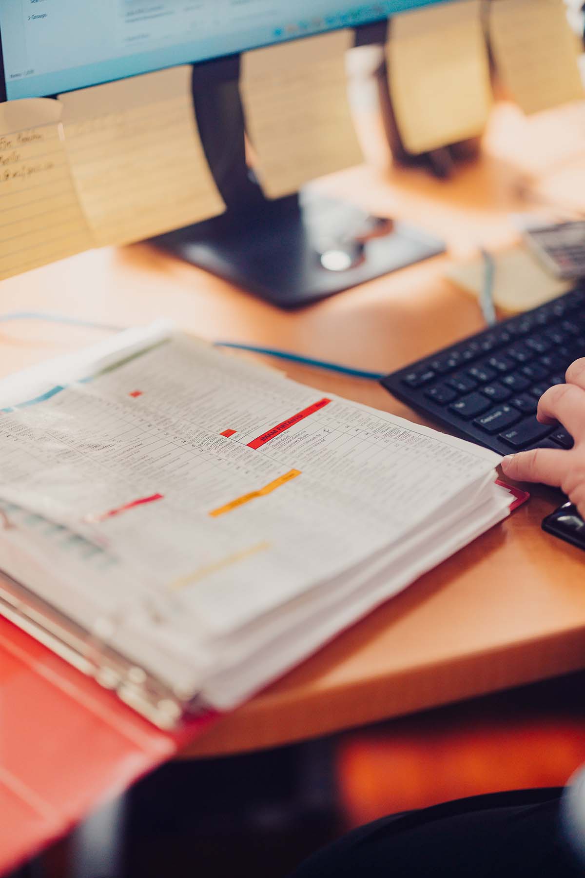 Paperwork next to the keyboard